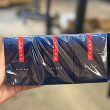Load image into Gallery viewer, Prada Ocean Luna Rossa EDT Eau de Toilette 12 x 1.2ml / 0.04 oz vials full sealed sleeve sample pack on blurred background - men's fresh aquatic woody fragrance
